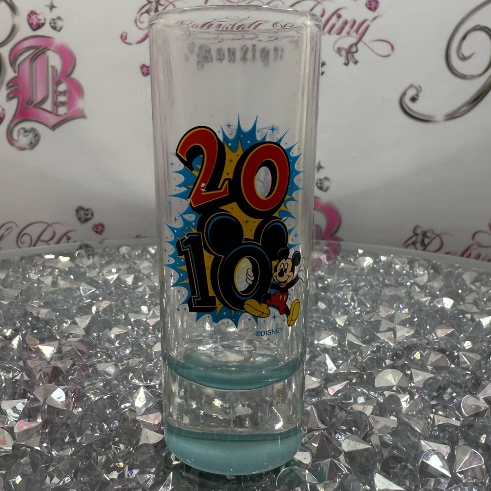 Disney Clear Shot Glass with Red, Yellow and Blue 2010 Mickey Graphic